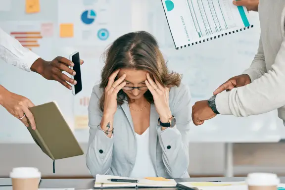 Woman practice owner feeling burnout effects from dentistry